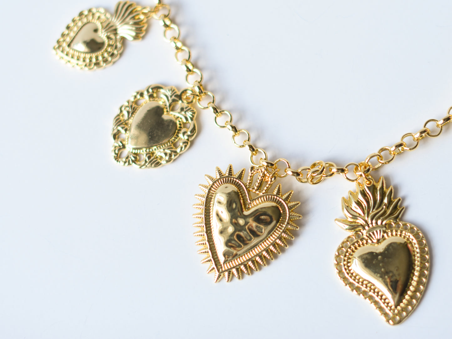 Milagro Hearts Charm Necklace – Gold & Silver Variants