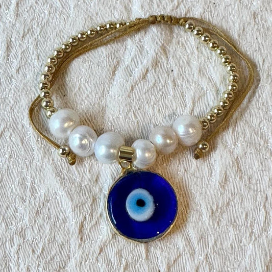 Elegant Pearl Bracelet with Blue Eye